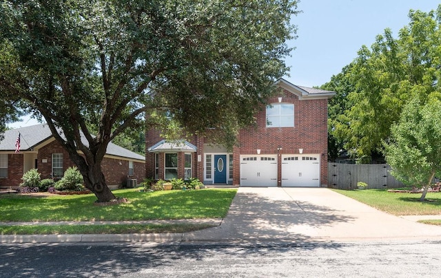 8507 Chat Ln, Round Rock, TX 78681 - view of front of home with concrete driveway, brick siding, and a garage