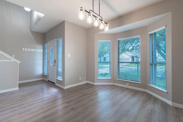 8507 Chat Ln, Round Rock, TX 78681 - unfurnished dining area with wood finished floors and baseboards