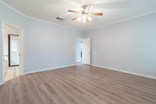 8507 Chat Ln, Round Rock, TX 78681 - spare room with wood finished floors, a ceiling fan, ornamental molding, and a textured ceiling