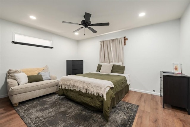 bedroom with recessed lighting, ceiling fan, baseboards, and wood finished floors