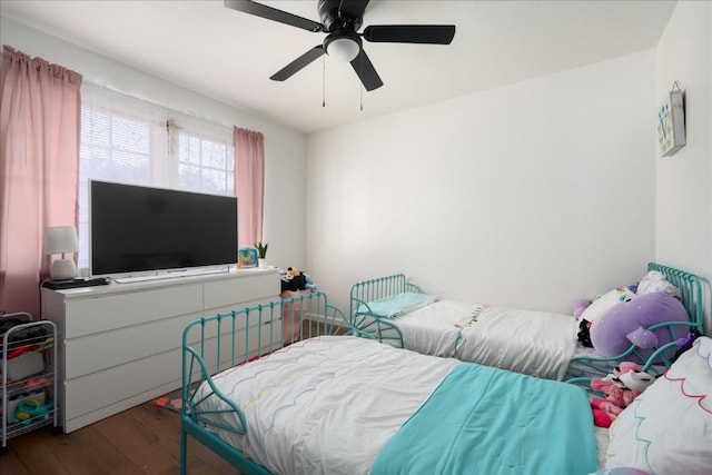 bedroom featuring ceiling fan and wood finished floors