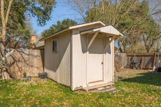 view of shed featuring a fenced backyard