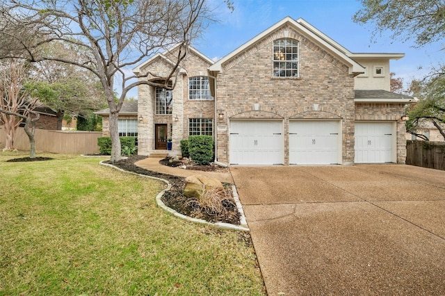 view of front of home featuring a garage, a front yard, fence, and driveway