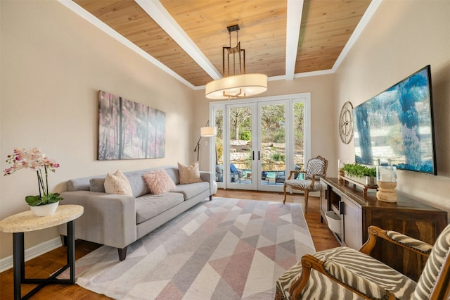 living area with ornamental molding, beam ceiling, wooden ceiling, and wood finished floors