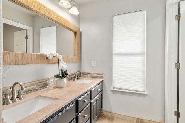 bathroom with double vanity and a sink