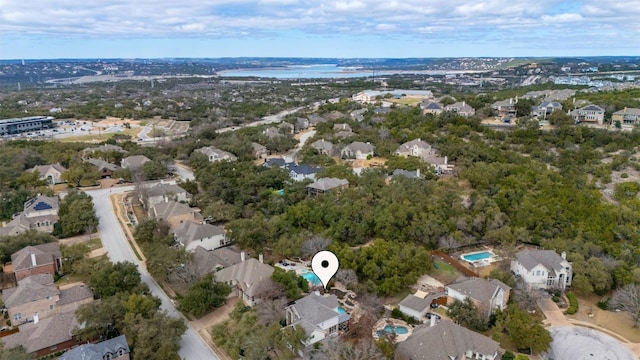 drone / aerial view featuring a water view and a residential view