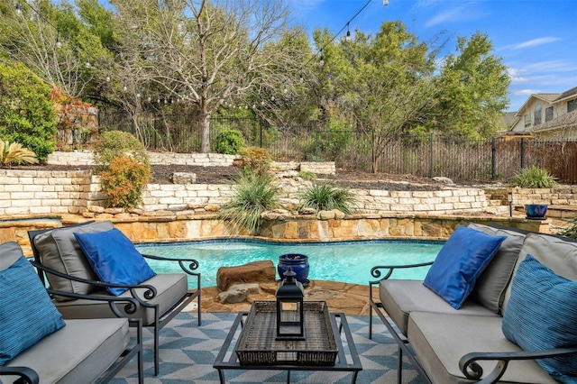 view of pool featuring a fenced backyard, an outdoor hangout area, a fenced in pool, and a patio