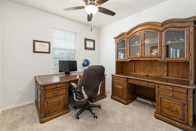 office with light carpet and ceiling fan