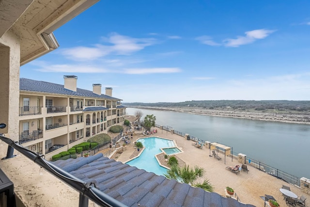 3404 American Dr Unit 1302, Lago Vista, TX 78645 - community pool with a water view and a patio area