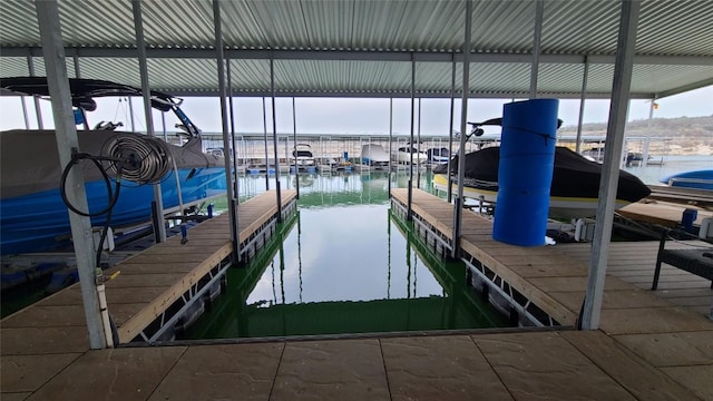 view of dock with a water view and boat lift