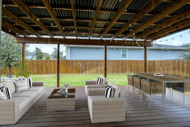 deck with a yard, outdoor dining space, a fenced backyard, and an outdoor living space