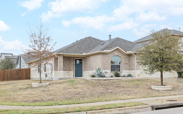 ranch-style house featuring driveway, a shingled roof, an attached garage, fence, and brick siding