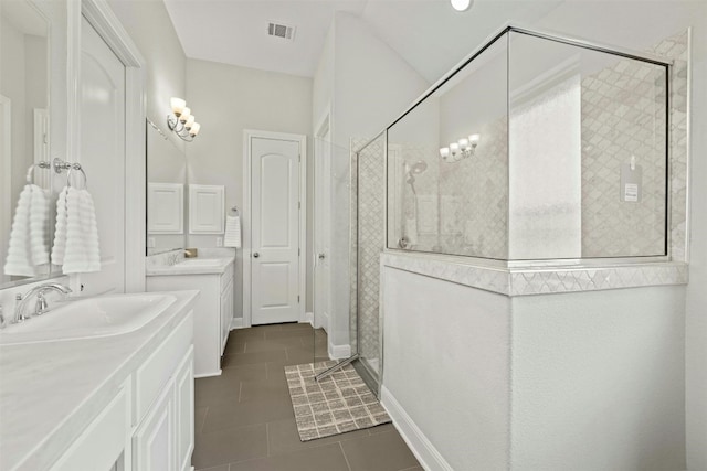 1820 Ficuzza Way, Leander, TX 78641 - bathroom with a shower stall, tile patterned flooring, and two vanities