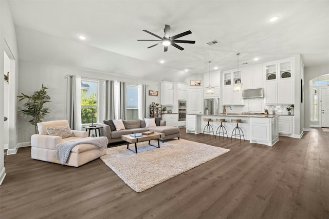 1820 Ficuzza Way, Leander, TX 78641 - living area featuring ceiling fan, lofted ceiling, dark wood-style flooring, recessed lighting, and baseboards