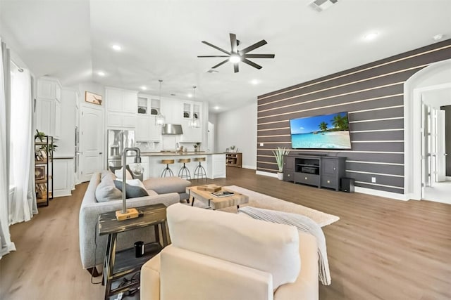 1820 Ficuzza Way, Leander, TX 78641 - living room featuring ceiling fan, light wood finished floors, recessed lighting, and baseboards