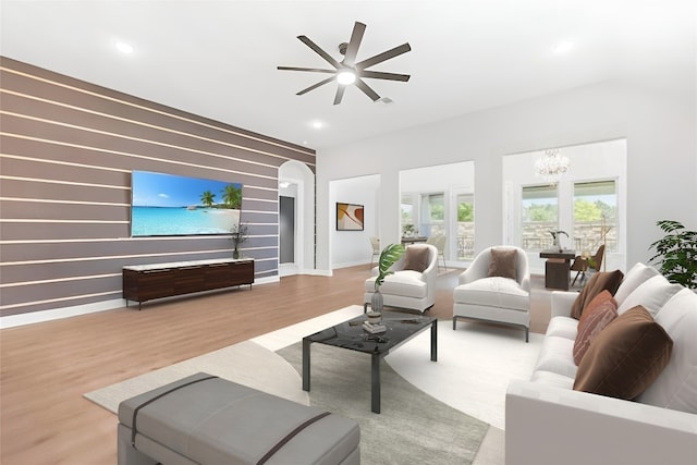 1820 Ficuzza Way, Leander, TX 78641 - living room featuring a chandelier, ceiling fan, wood finished floors, recessed lighting, and arched walkways