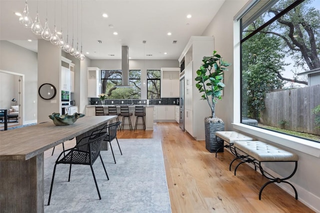 4907 Timberline Dr, Austin, TX 78746 - dining space with light wood finished floors and recessed lighting