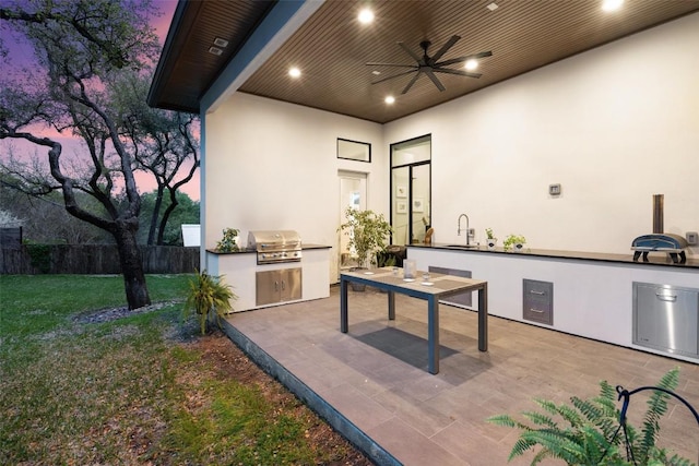 4907 Timberline Dr, Austin, TX 78746 - patio terrace at dusk with ceiling fan, a patio, and a sink