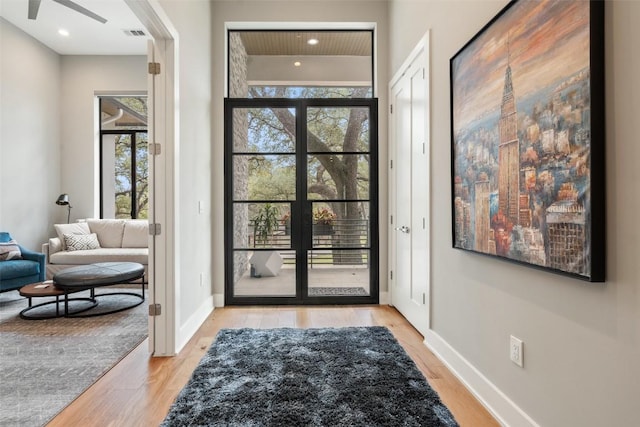 4907 Timberline Dr, Austin, TX 78746 - entrance foyer featuring light wood finished floors, a ceiling fan, baseboards, and french doors