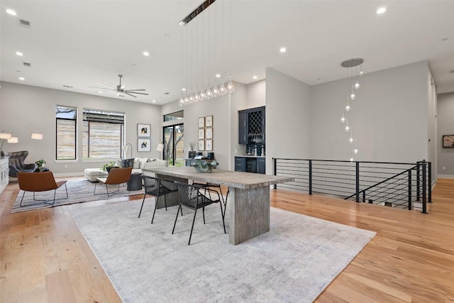 4907 Timberline Dr, Austin, TX 78746 - dining room featuring light wood-style floors, plenty of natural light, a ceiling fan, recessed lighting, and baseboards