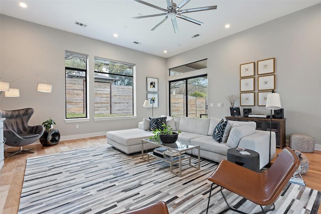 4907 Timberline Dr, Austin, TX 78746 - living room featuring plenty of natural light, light wood finished floors, recessed lighting, a ceiling fan, and baseboards