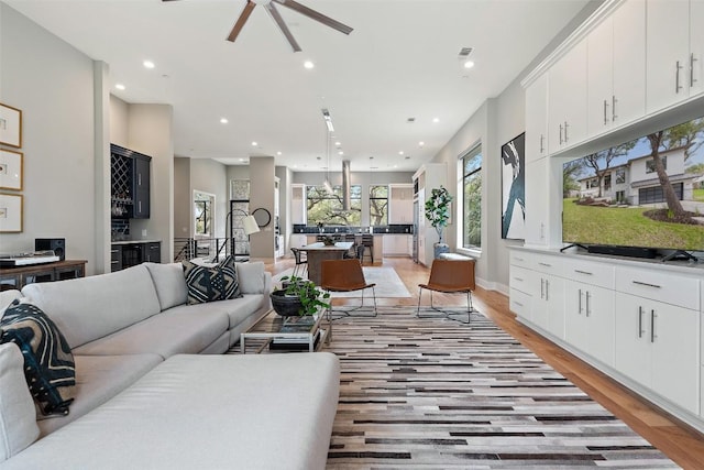 4907 Timberline Dr, Austin, TX 78746 - living area featuring recessed lighting, light wood-style floors, a ceiling fan, and baseboards