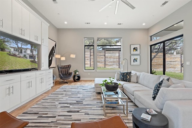 4907 Timberline Dr, Austin, TX 78746 - living area with light wood-style flooring, recessed lighting, ceiling fan, and baseboards