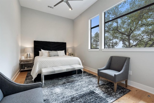4907 Timberline Dr, Austin, TX 78746 - bedroom with wood finished floors, baseboards, and a ceiling fan