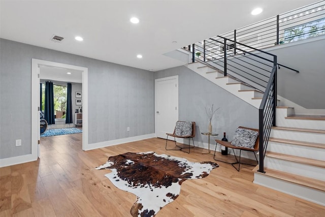 4907 Timberline Dr, Austin, TX 78746 - foyer featuring stairway, baseboards, wood finished floors, and recessed lighting