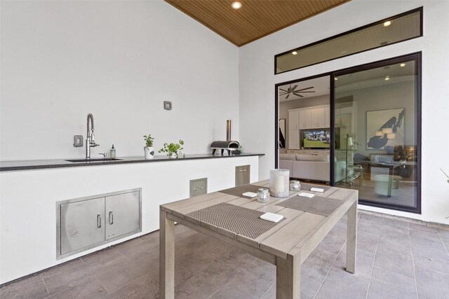 4907 Timberline Dr, Austin, TX 78746 - tiled dining room featuring a sink, wooden ceiling, vaulted ceiling, and recessed lighting