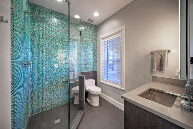 15210 Rainbow One St, Austin, TX 78734 - full bathroom with toilet, vanity, a stall shower, baseboards, and recessed lighting