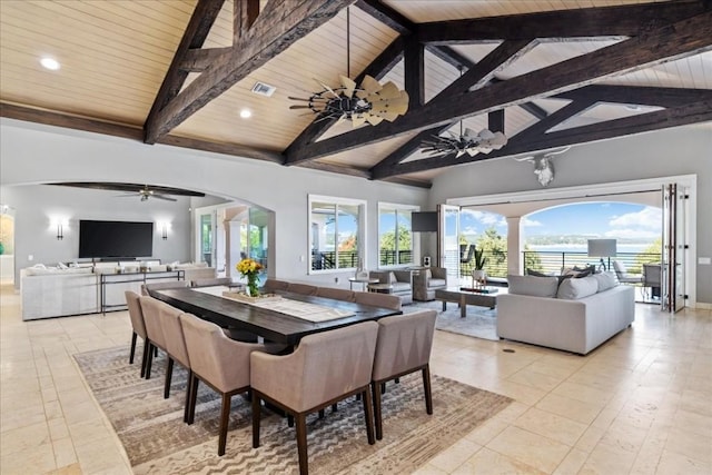 dining space featuring arched walkways, high vaulted ceiling, wood ceiling, a ceiling fan, and beamed ceiling