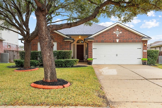 ranch-style house with a garage, a front yard, cooling unit, and brick siding