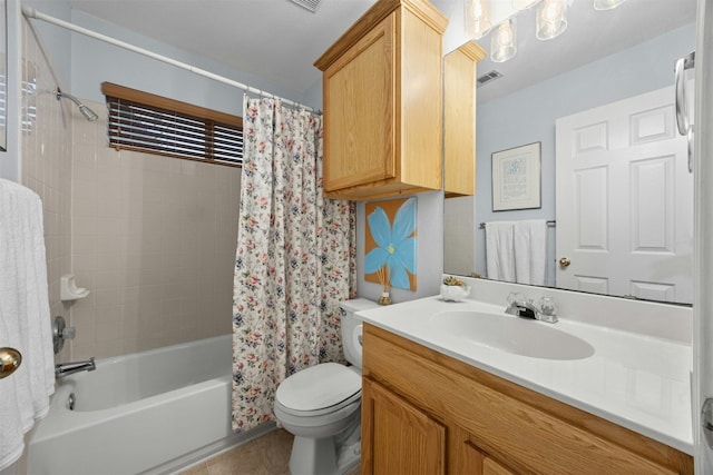 bathroom featuring visible vents, toilet, shower / tub combo, vanity, and tile patterned floors