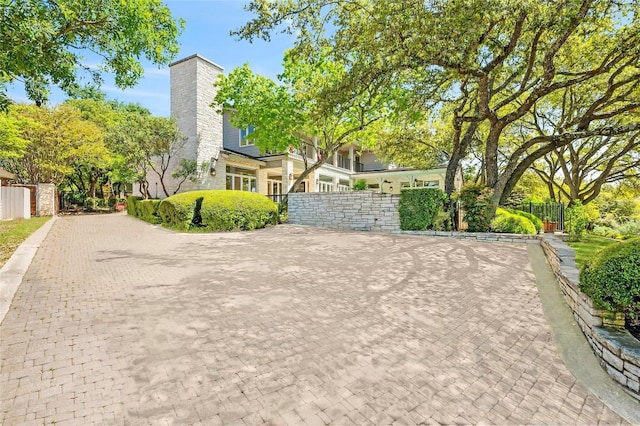 view of front of house with fence