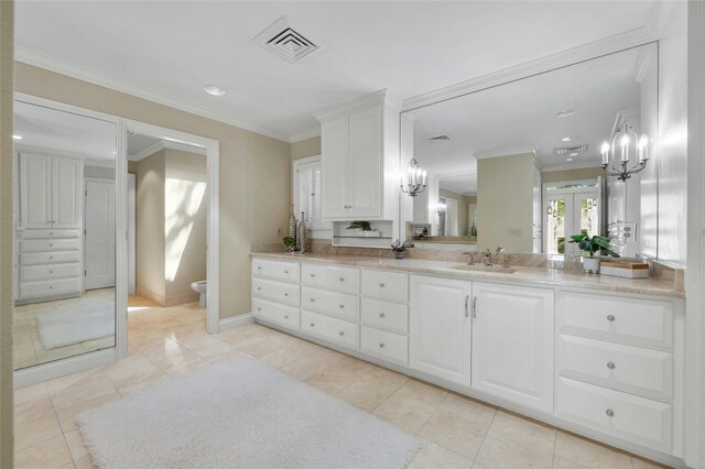 126 Firebird St, Lakeway, TX 78734 - bathroom with a chandelier, vanity, tile patterned flooring, crown molding, and recessed lighting