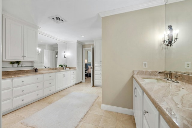 bathroom with ornamental molding, visible vents, vanity, and tile patterned floors