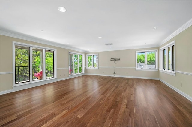 126 Firebird St, Lakeway, TX 78734 - unfurnished living room with wood finished floors, ornamental molding, baseboards, and recessed lighting