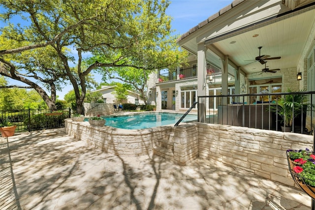 view of pool featuring a fenced in pool, fence, a ceiling fan, and a patio