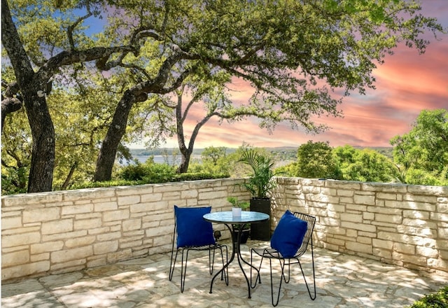 patio terrace at dusk with outdoor dining space