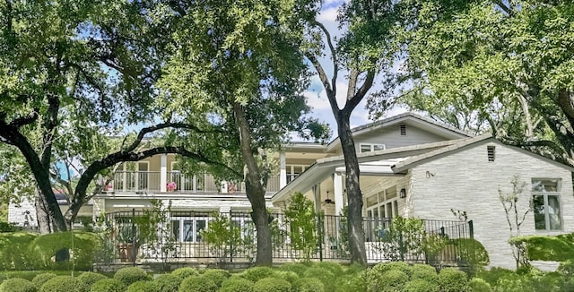 126 Firebird St, Lakeway, TX 78734 - view of home's exterior featuring stone siding and a balcony