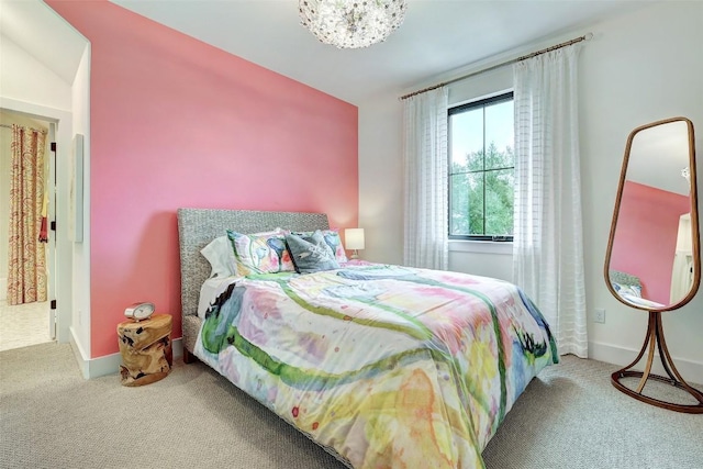 bedroom featuring carpet and baseboards