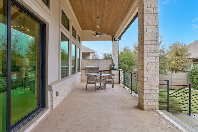 view of patio with ceiling fan, grilling area, and outdoor dining space