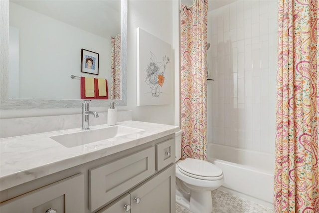 bathroom featuring vanity, toilet, and shower / bath combo with shower curtain