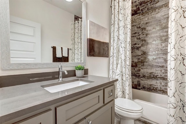 full bathroom featuring vanity, shower / bath combination with curtain, and toilet