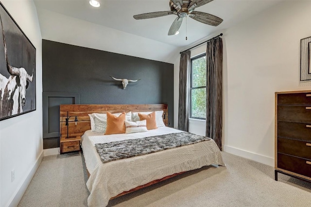 bedroom with recessed lighting, light colored carpet, a ceiling fan, vaulted ceiling, and baseboards