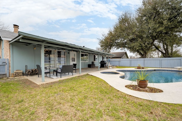 back of house with a fenced backyard, an in ground hot tub, a lawn, a fenced in pool, and a patio area