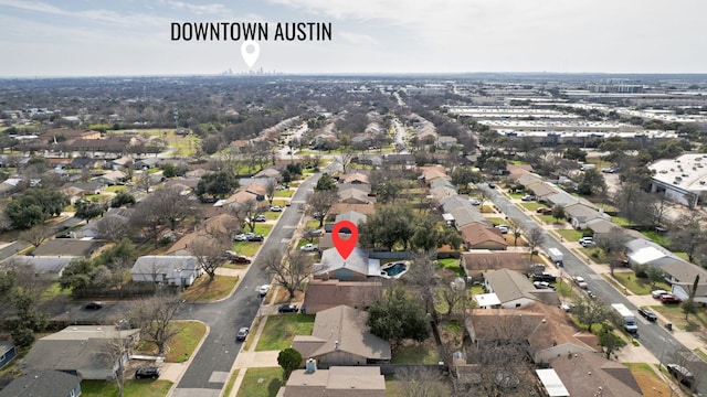 birds eye view of property with a residential view