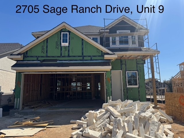 property in mid-construction featuring a garage