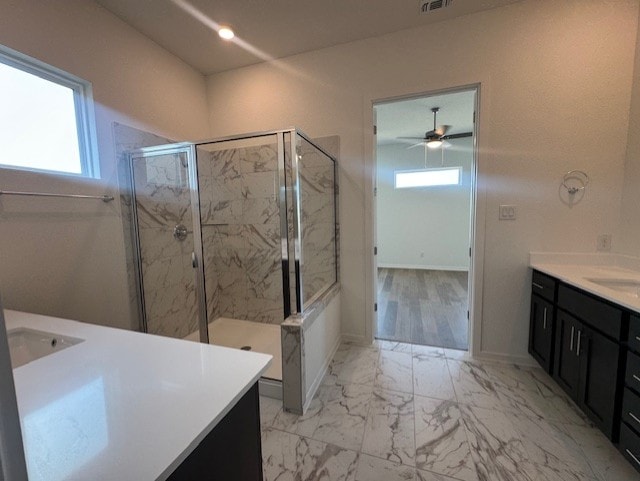 2705 Sage Ranch Dr Unit 24, Leander, TX 78641 - full bathroom with vanity, a shower stall, a ceiling fan, and marble finish flooring